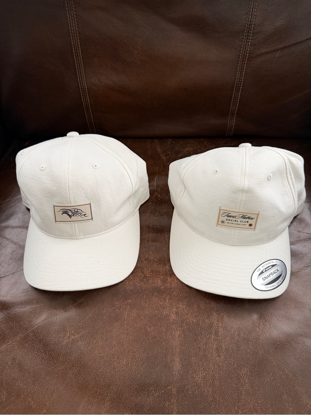 Two Travis Mathew Hats - White
